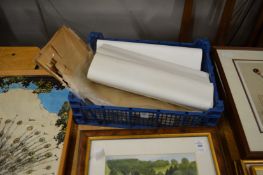 A group of unframed pictures.