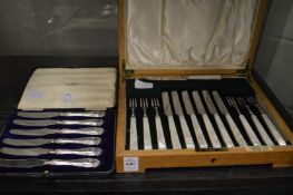 A Harrods cased set of six fruit knives and forks with mother of pearl handles together with a cased