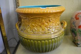 A large pottery jardiniere.