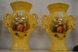 A pair of Aynsley limited edition fruit decorated twin handled vases.