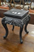 A Chinese carved wood stand.