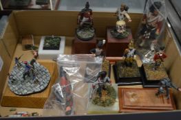 A collection of military figures, most on bases.