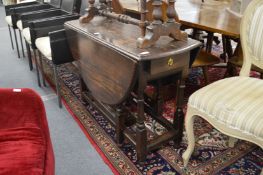 An oak drop leaf gateleg dining table.