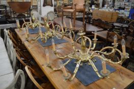 A set of three good quality heavy brass eight branch chandeliers.