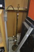 A brass floor standing lamp.