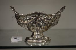A silver pierced pedestal basket.