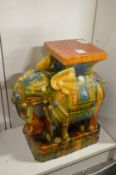 A colourful Chinese elephant form jardiniere stand.