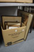 A box of paintings and prints.