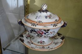 A large soup tureen cover and stand.