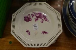 A set of six puce decorated octagonal shaped plates with pierced borders.
