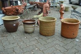 Four various garden planters.