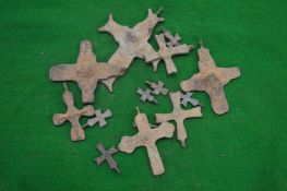 A collection of bronze crucifixes.