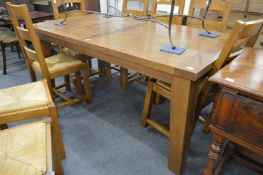 A good modern oak extending dining table.