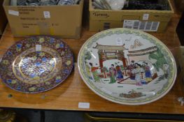 A large Chinese dish and a floral decorated plate.