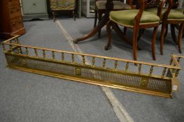 A very good 19th century brass fender of Adam design with turned finials and pierced front, 5'