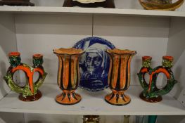 A pair of lustre glazed vases, a pair of unusual candlesticks and a blue and white plate.