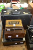 Three metal cash boxes and an attache case.