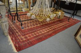 A good large Persian Bokhara carpet, beige ground with five rows of twenty two gulls 9' 10