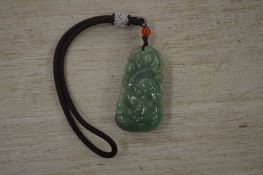 A Chinese jade pendant.