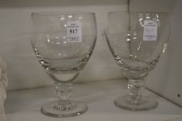 A pair of large wine glasses.