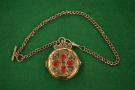 Decorative pocket watch and chain.