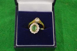 A gold and diamond single stone ring together another ring.