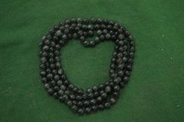 A malachite bead necklace.