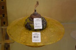 A glass bowl and small glass lamp.