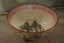 A large lustre ware bowl decorated with the ship Caroline and the Ship Wrights Arms.