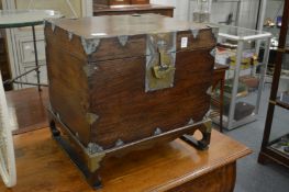An Eastern brass bound box on stand.