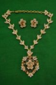 A highly ornate necklace with pair of matching ear clips.