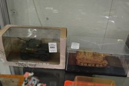 Five boxed military vehicles.