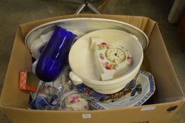 A box of decorative china and glass.
