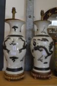 A large pair of Chinese pottery vase lamps (faults).