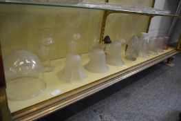 Various glass lamp shades and oil lamp chimneys etc.