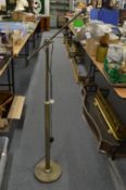 A floor standing adjustable reading lamp.