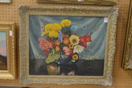 A still life of flowers in a vase, oil on board.