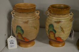 A pair of Crown Devon twin handle vases.