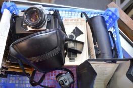 A Nikon FG-20 SLR camera and associated items.