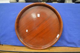 A mahogany circular tray.