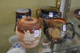 A Doulton salt glazed tobacco jar and cover and three other items.