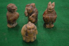 Four carved netsukes.