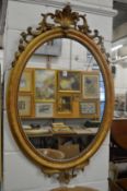 A good gilt framed oval wall mirror.
