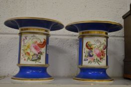 A pair of flared rim vases, blue ground with panels of flowers.