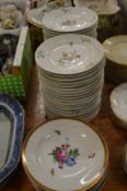 A collection of floral decorated plates.