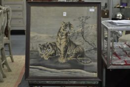 A Japanese embroidered picture of two tigers.