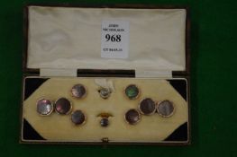 A cased set of cufflinks and dress studs.