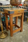 A butchers block on stand.
