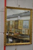 A small gilt framed mirror.