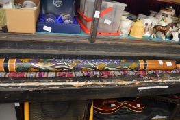 A Didgeridoo and an Oriental parasol.